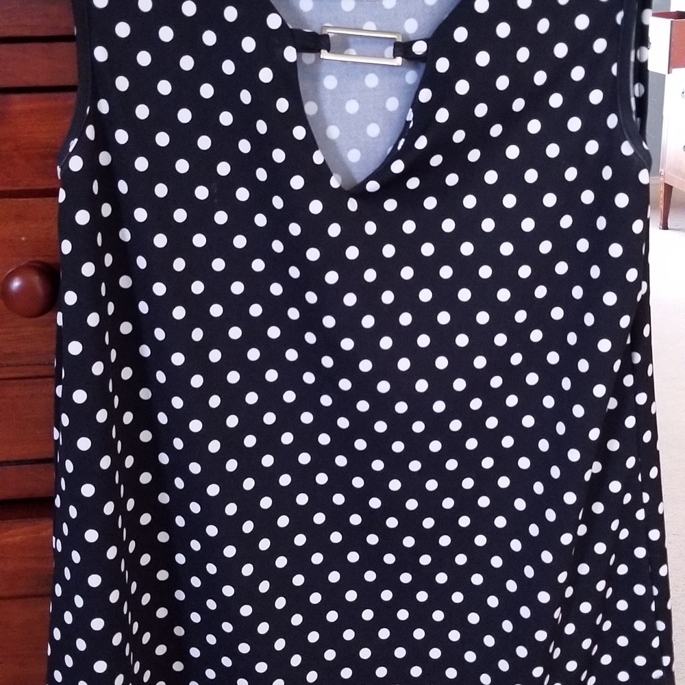 Black and white polka dot sleeveless blouse